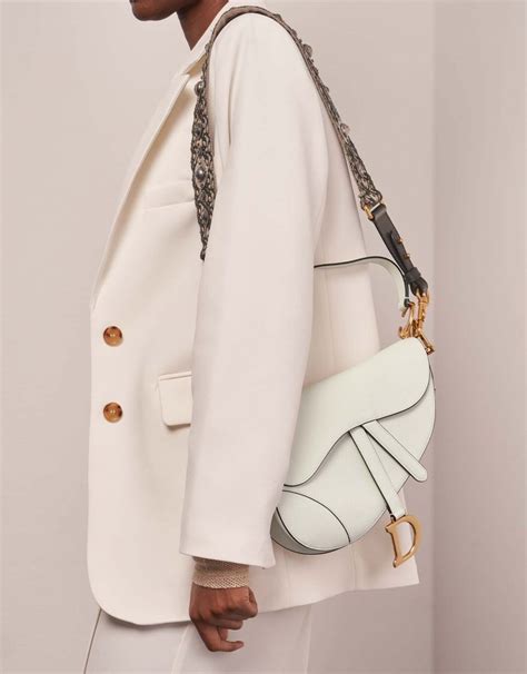 white dior saddle bag|Dior saddle bag street style.